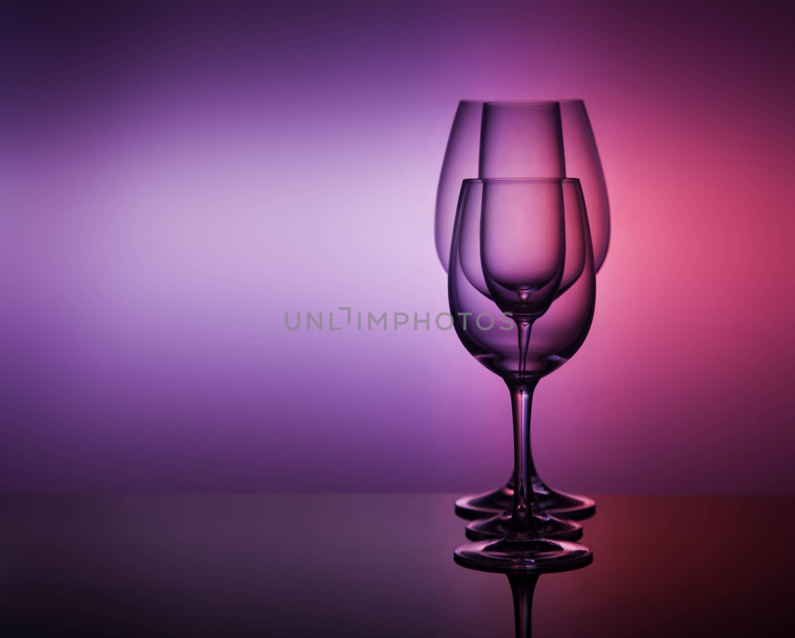 close-Up view Of various empty Glasses Against Colored Background by galinasharapova