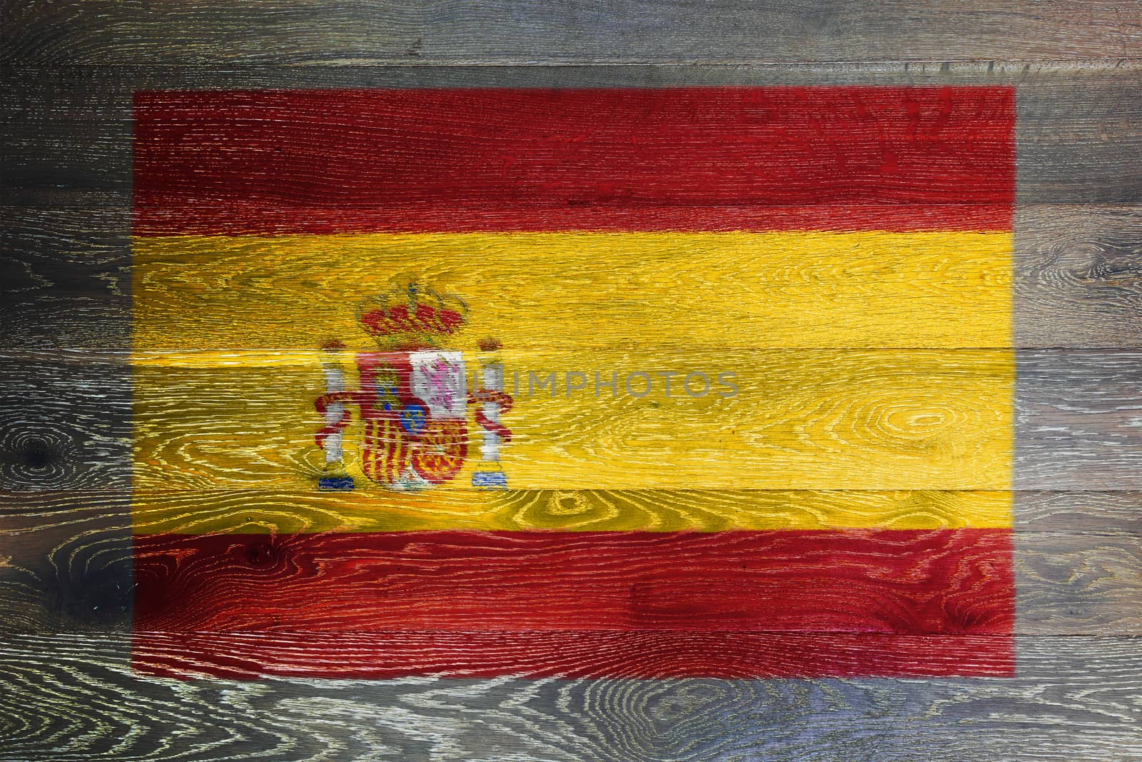A Spain flag on rustic old wood surface background
