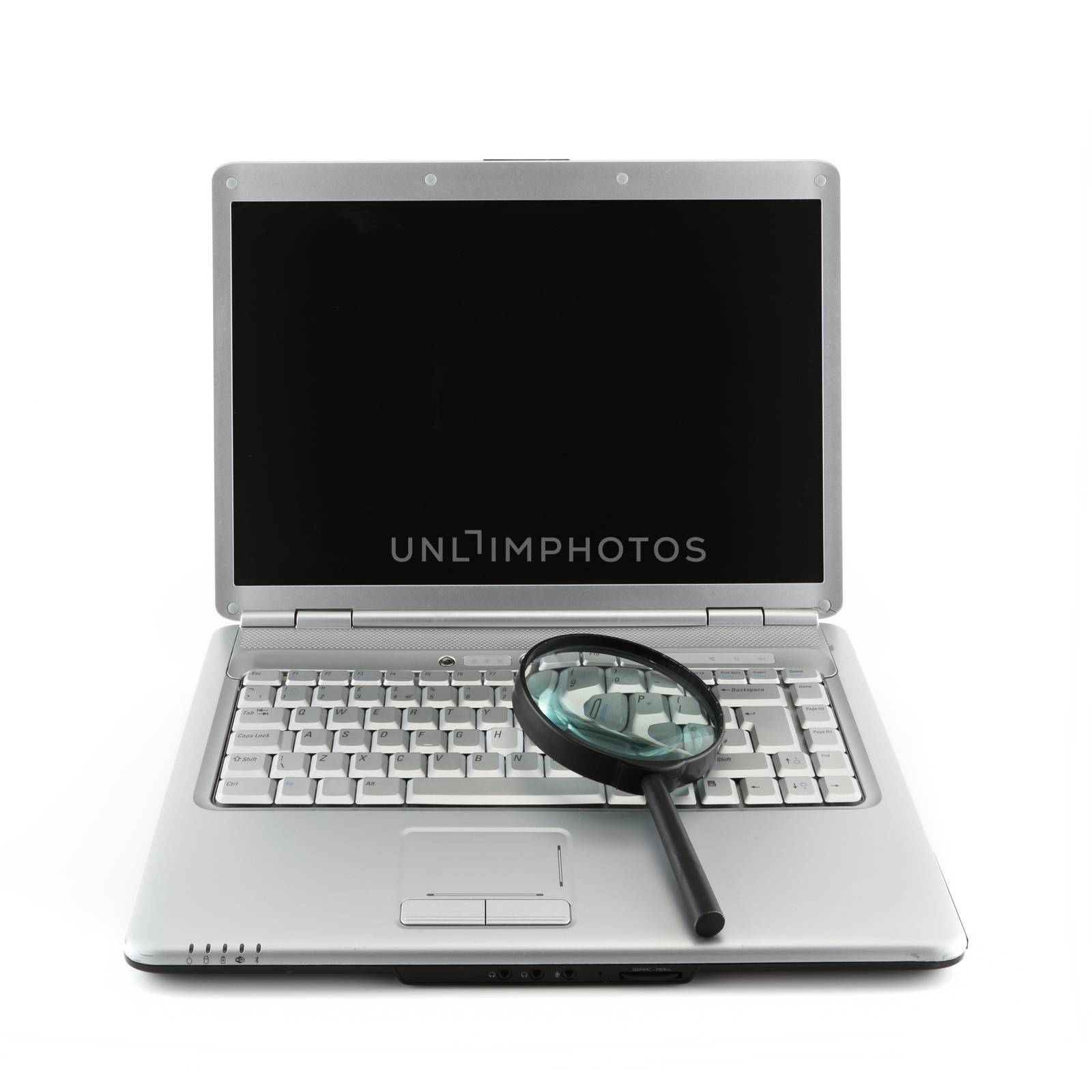 A Laptop PC and magnifying glass indicating data security concept