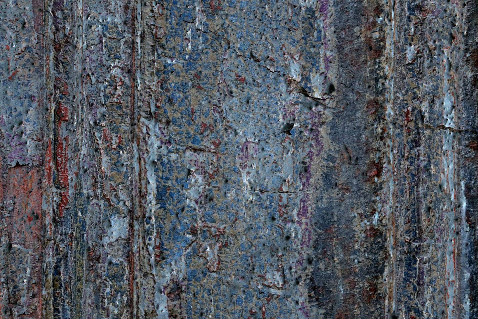 Detailed and colorful close up at cracked and peeling paint on concrete wall textures in high resolution.