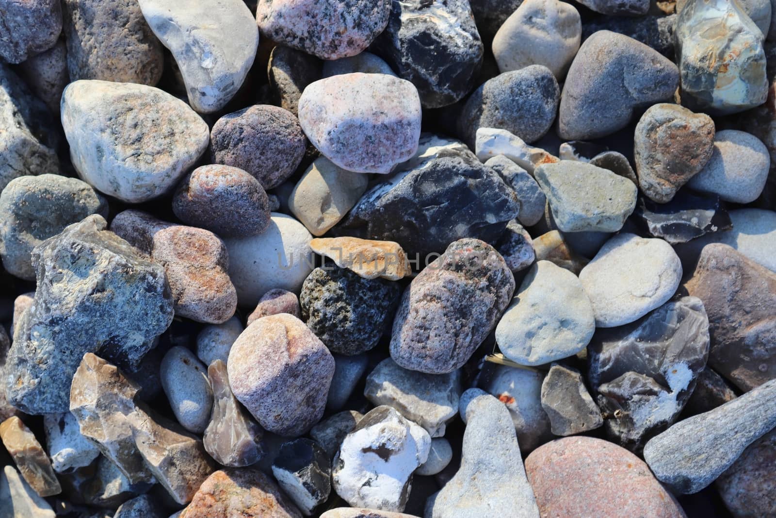 Beautiful stone pebbles at the beach of the baltic sea in the north of Germany