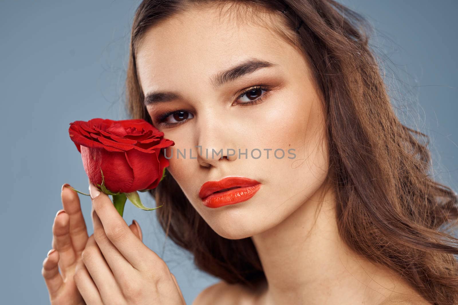 woman with a rose in her hands naked shoulders evening makeup red lips by SHOTPRIME
