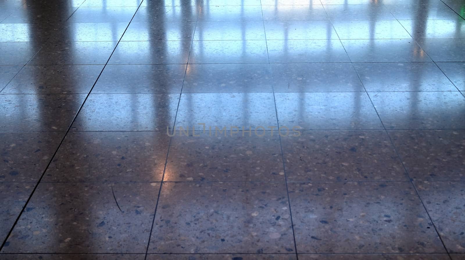 Detailed close up texture on structured floor tiles on a ground