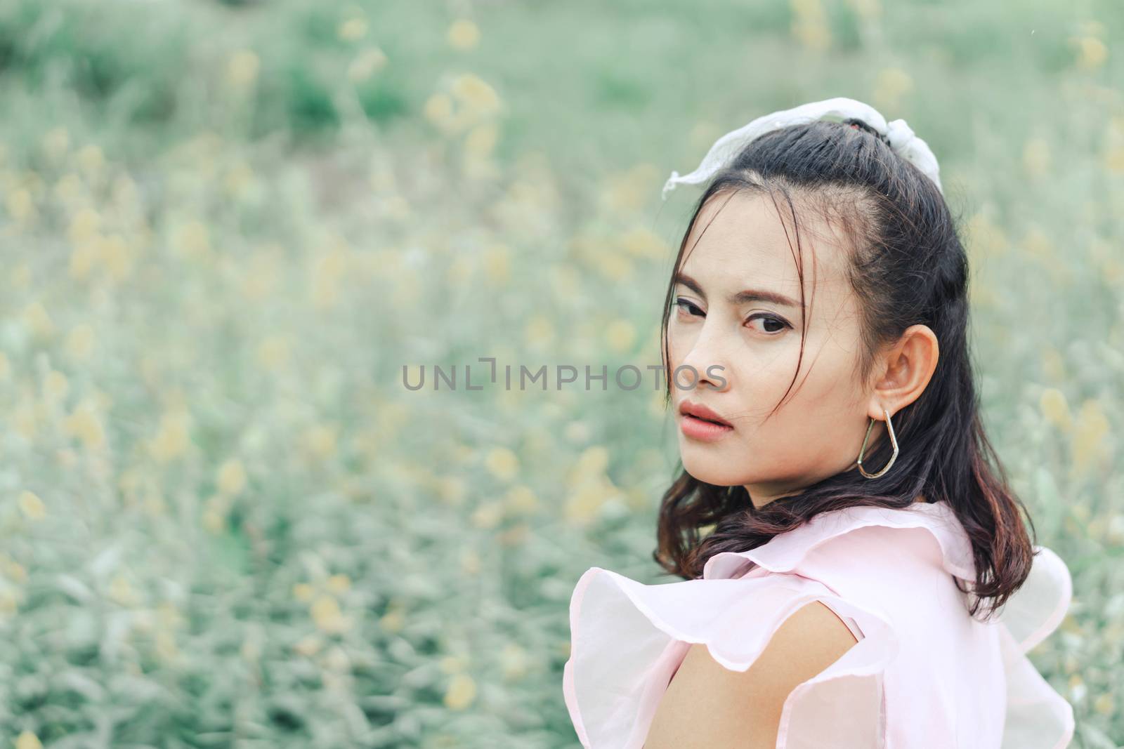 Portrait of asian woman posting and camara with flower garden