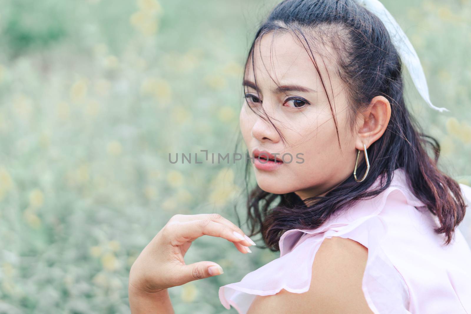 Portrait of asian woman posting and camara with flower garden