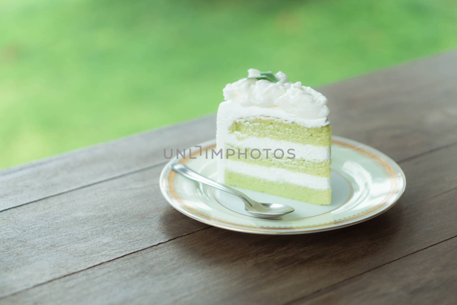 Closeup coconut cake delicious on wood table background, selective focus