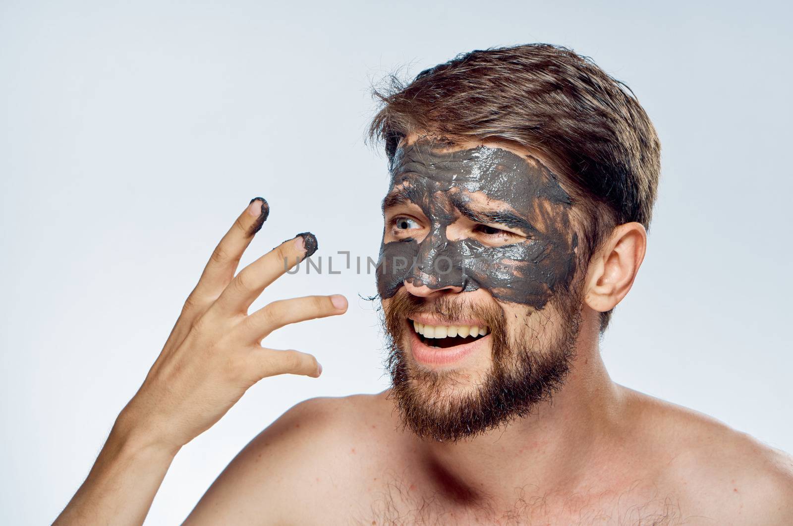 Man in black mask on face clean skin lifestyle naked shoulders hygiene health by SHOTPRIME