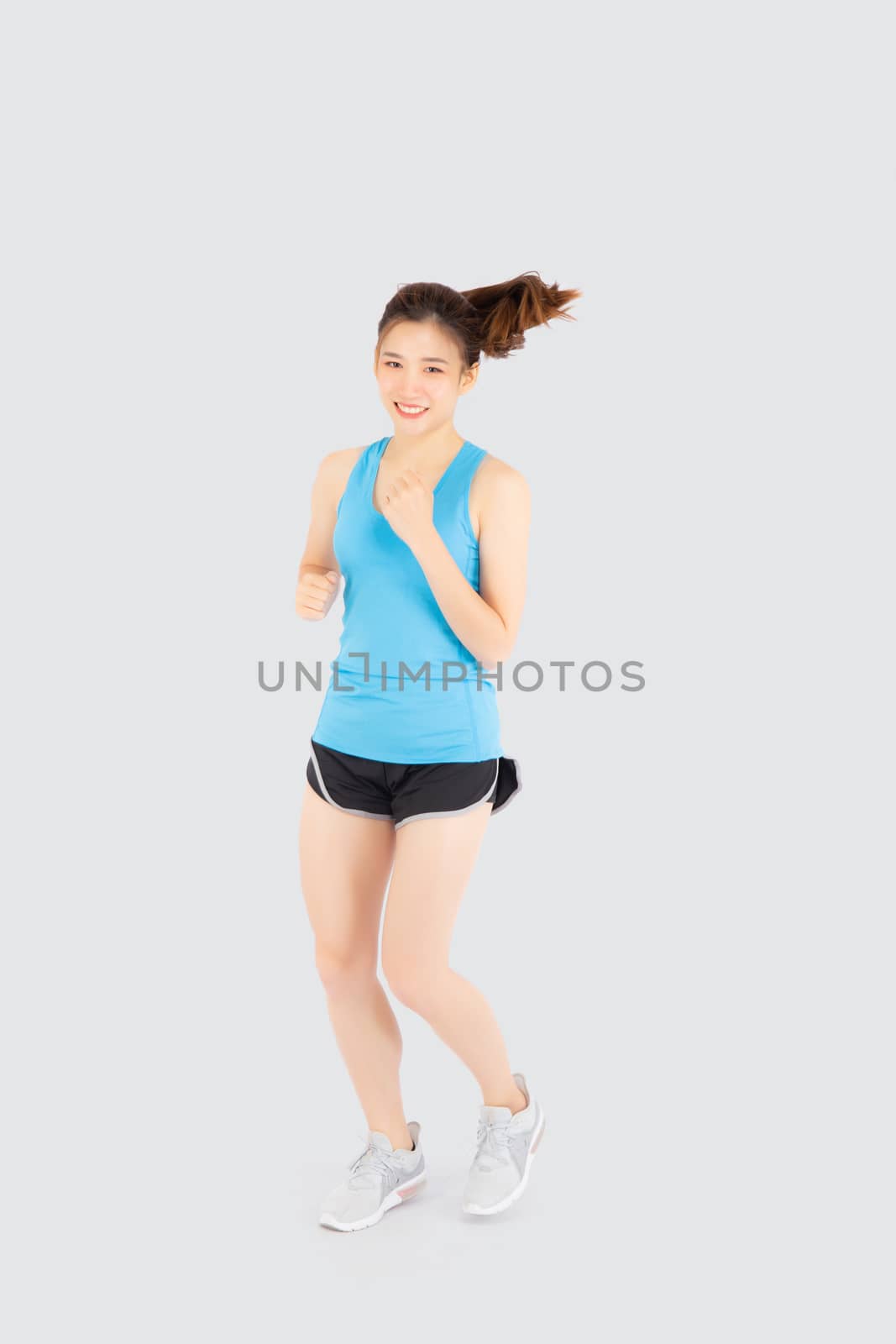 Beautiful young asian woman happy and smiling jogging isolated on white background, asia girl cheerful in sport is activity exercise cardio and workout with running for healthy, health concept.