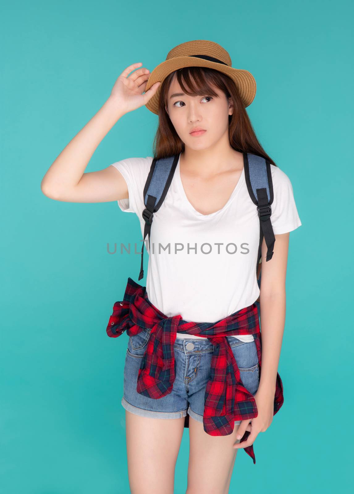 Beautiful young asian woman upset and worry travel summer trip in abroad isolated on blue background, tourist asia girl having problem and stress journey in vacation for leisure, holiday concept.