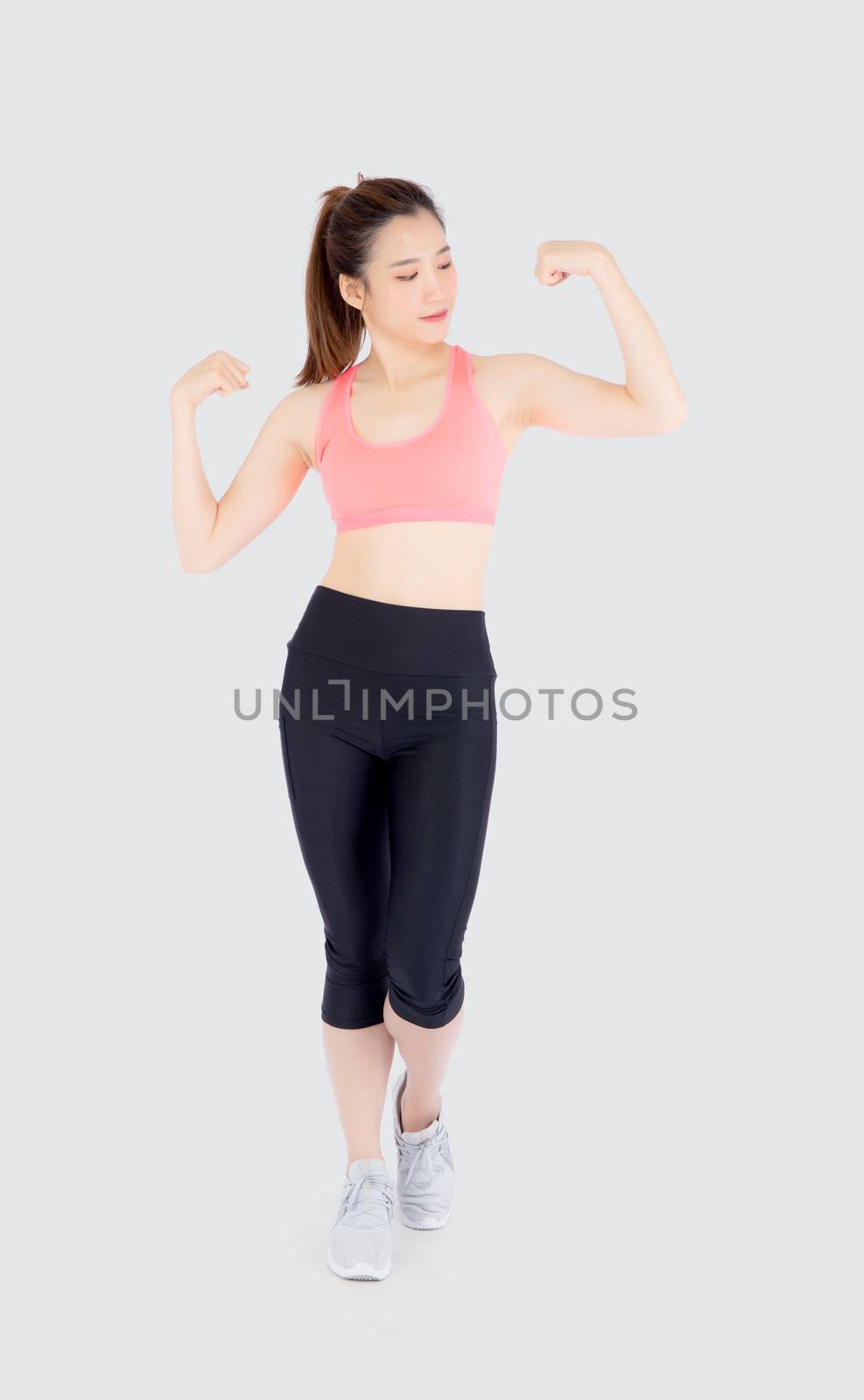 Beautiful portrait young asian woman wear sport clothes strong and muscle with health, girl show biceps with exercise and workout for wellness isolated on white background, strength and fit concept.