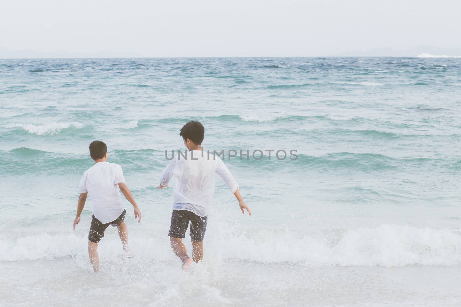 Homosexual portrait young asian couple running with cheerful tog by nnudoo