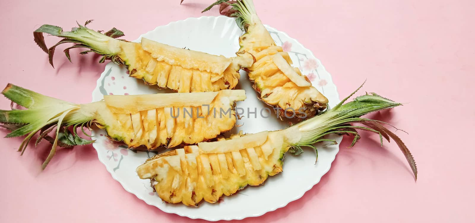 tasty and healthy orange colored pineapple stock on plate