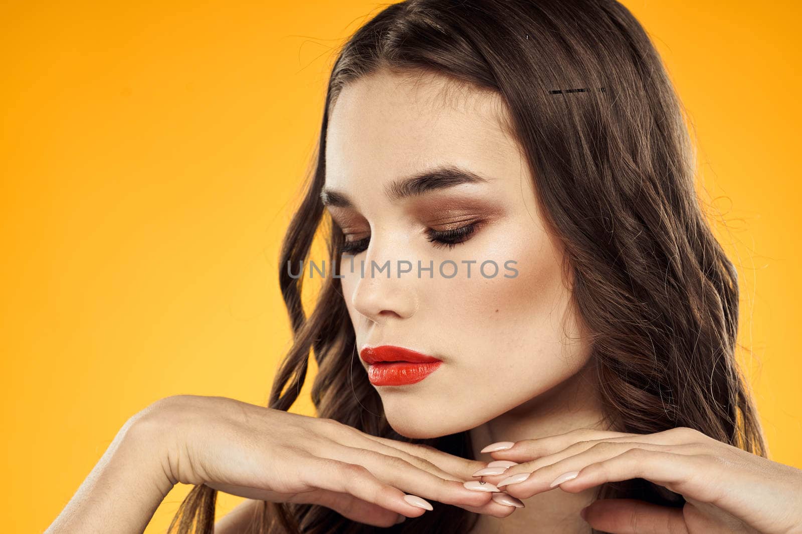 Woman with bare shoulders red cropped lips charm yellow background. High quality photo