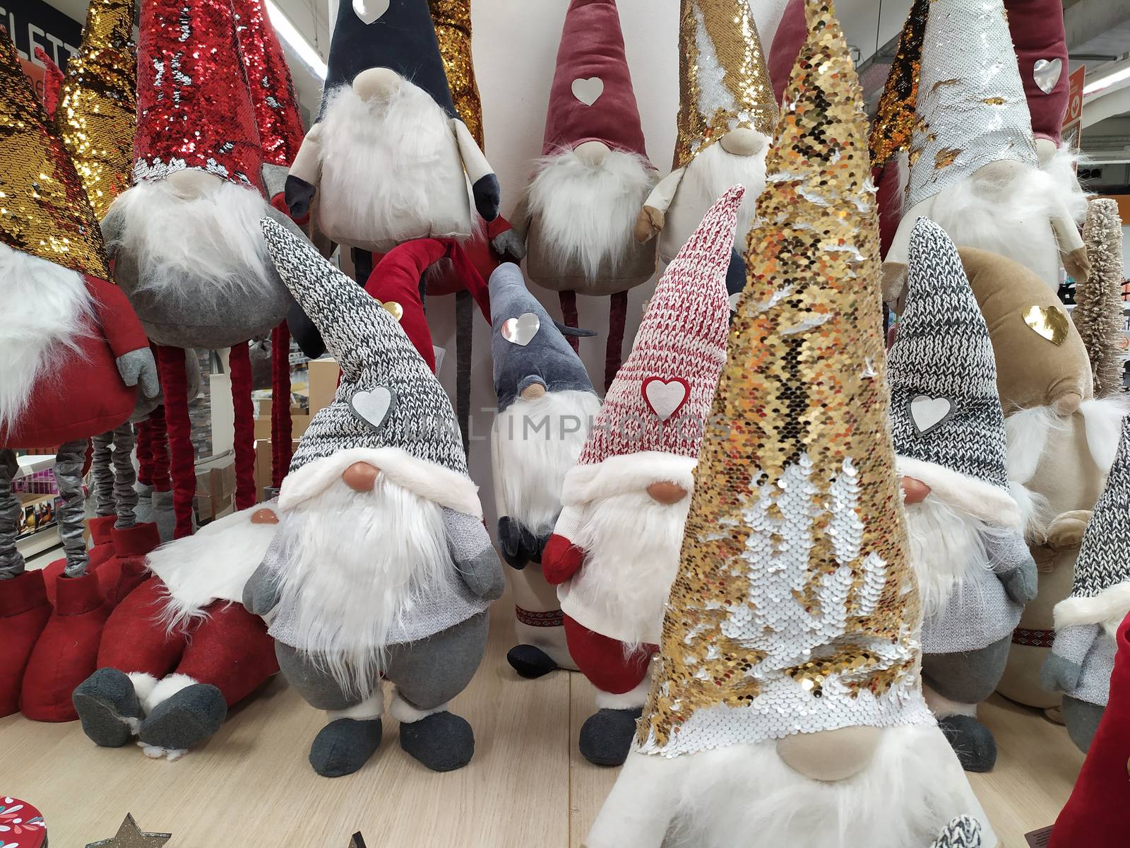 Christmas decorations displayed in a shop, puppets with the features of gnomes