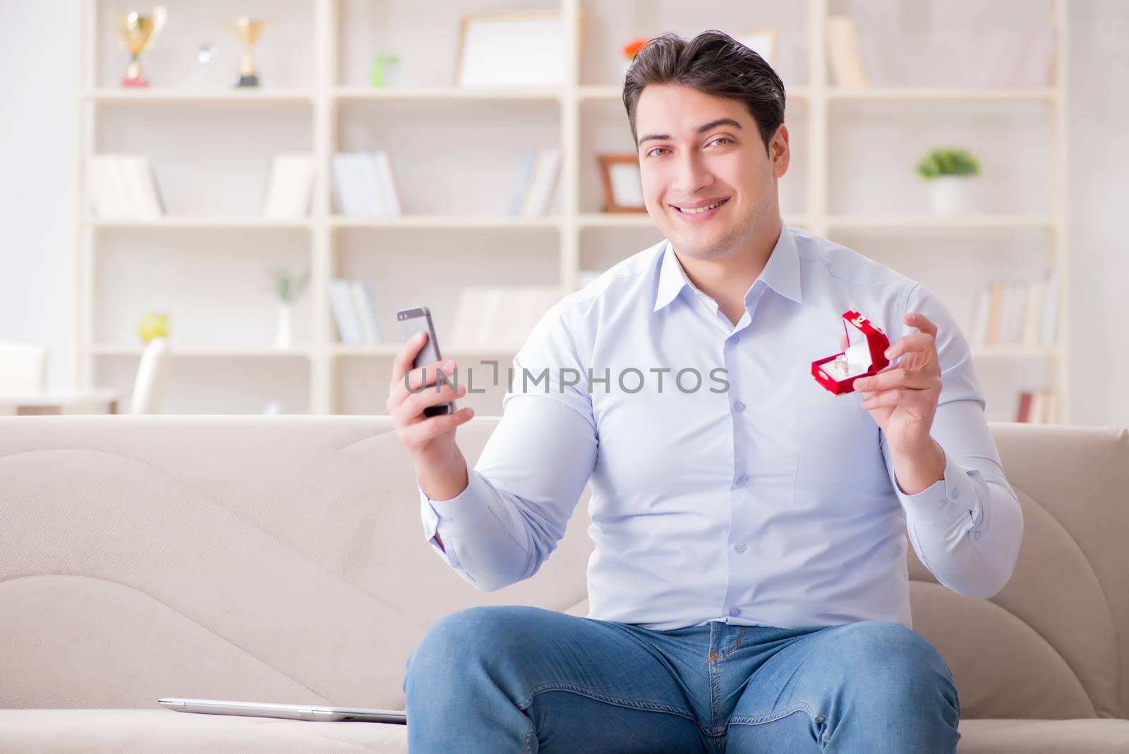 Young man chatting with his sweetheart over mobile phone