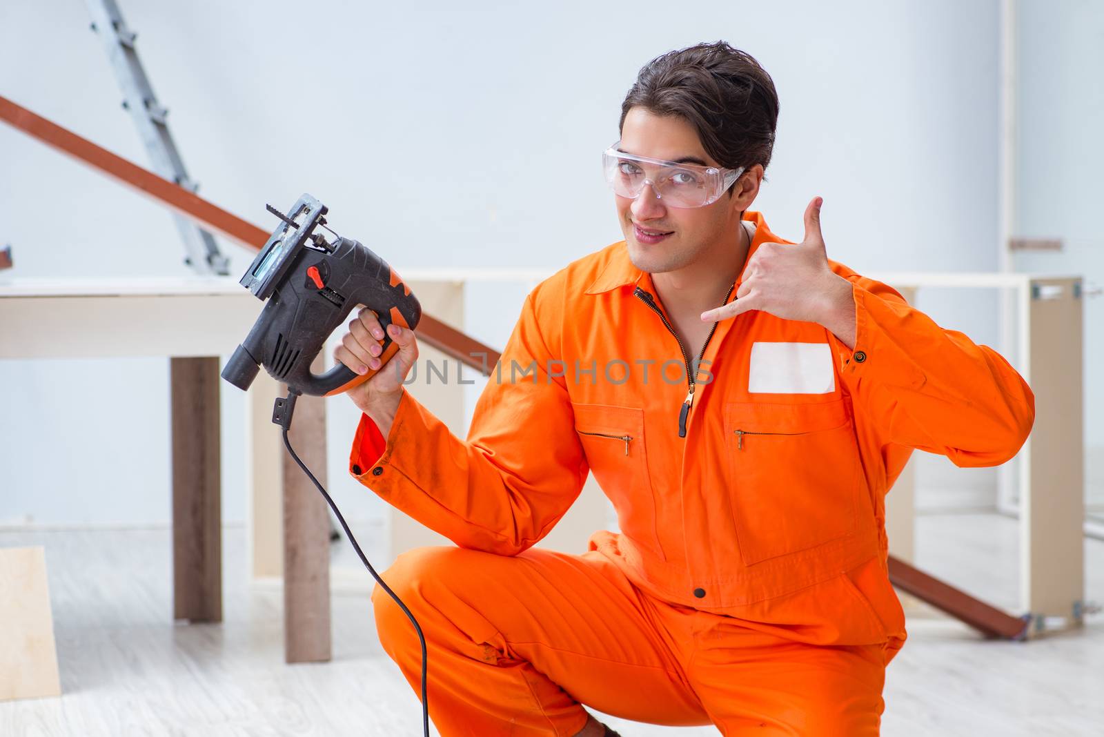 Contractor working on laminate wooden floor
