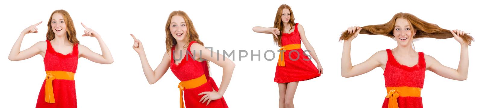 Young beautiful girl in red dress pointing isolated on white by Elnur