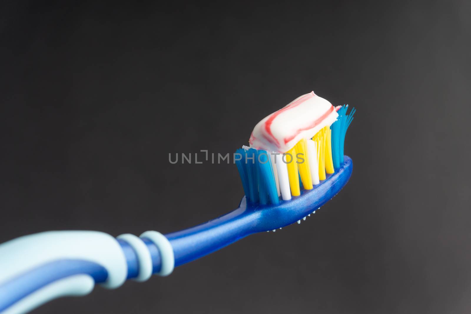 Toothbrush closeup on white background. Healthy concept