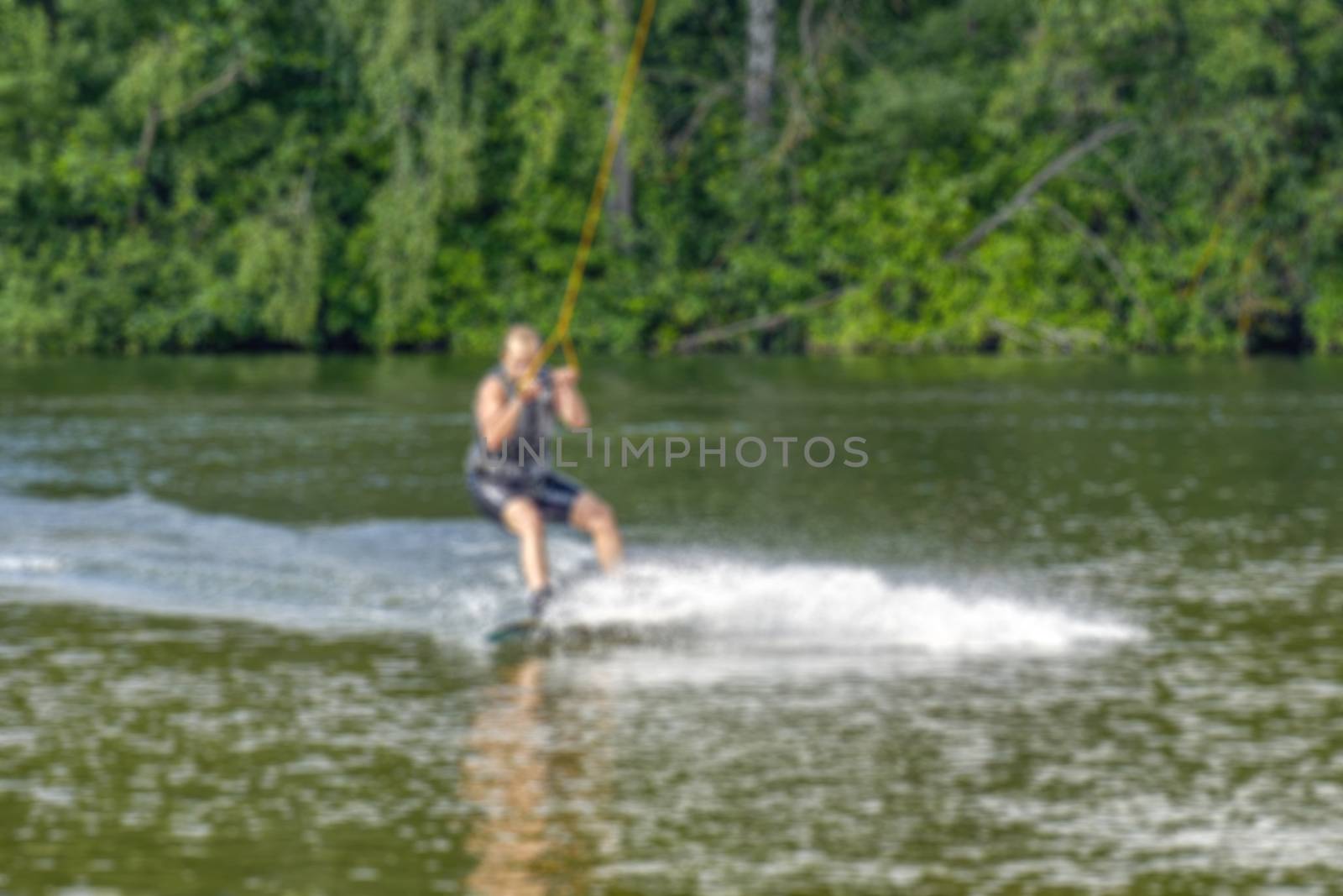 Creative story on the topic of kitesurfing with the blur and bokeh elements for thematic backdrops, posters and banners.