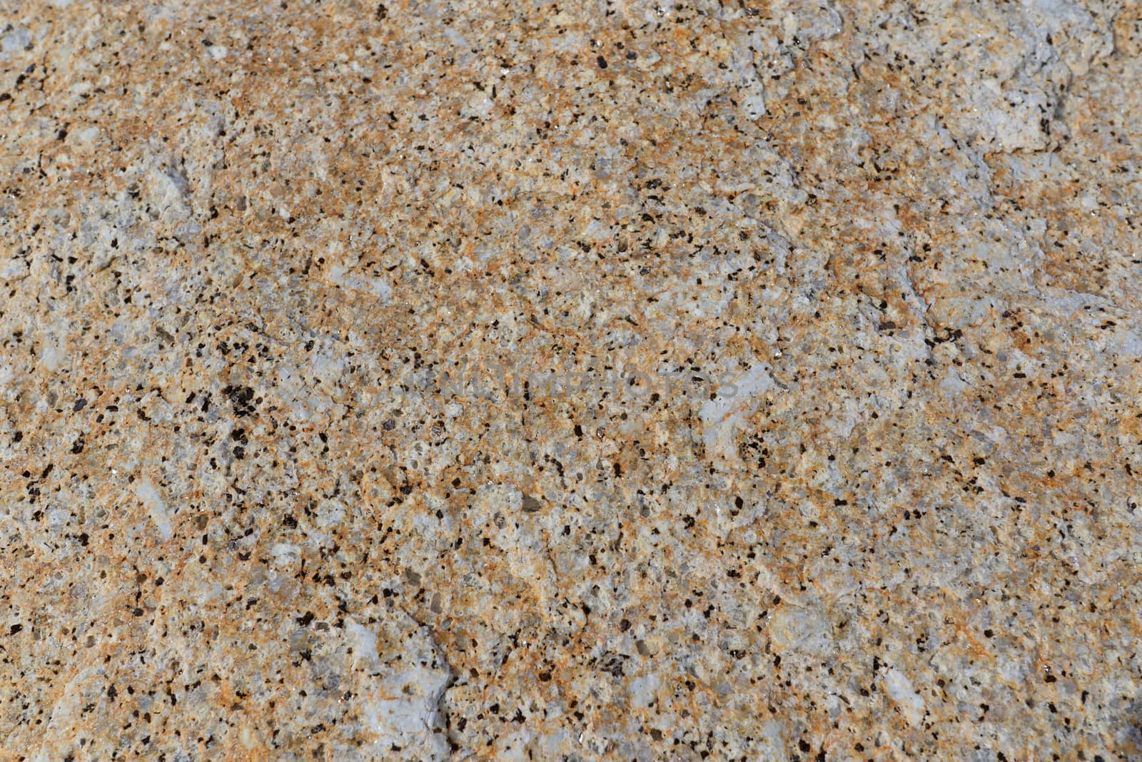 Brown gray granite wall stone background or texture pattern solid nature rock