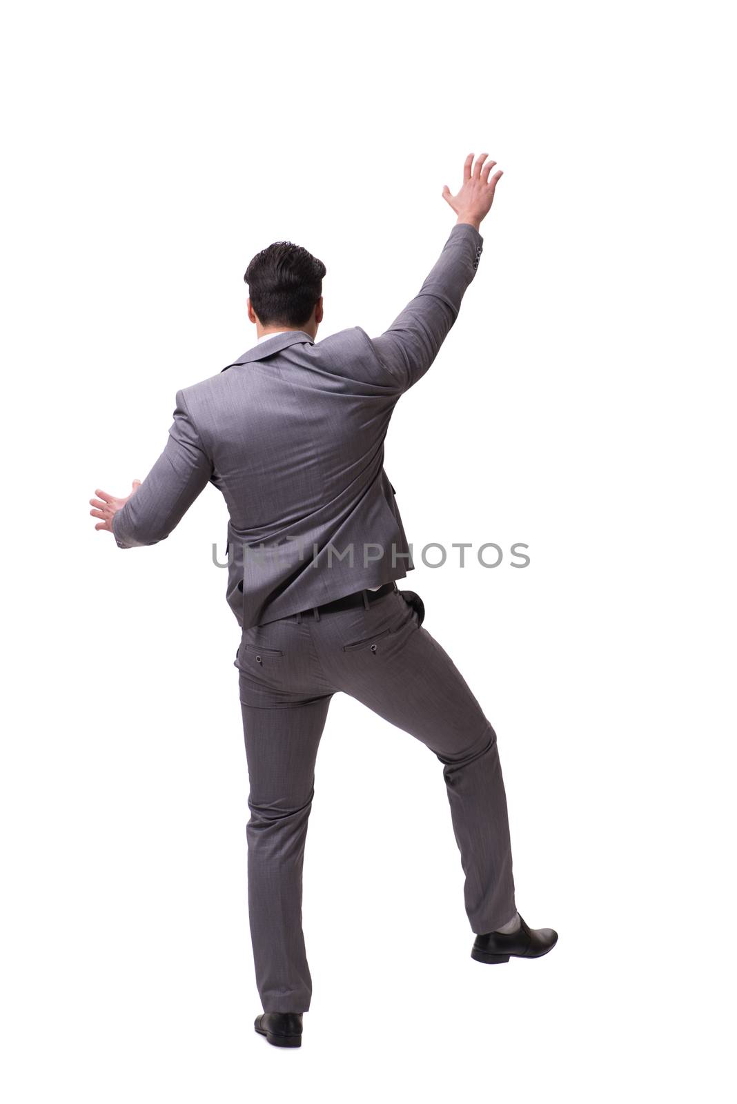 Businessman climbing virtual obstacle isolated on white