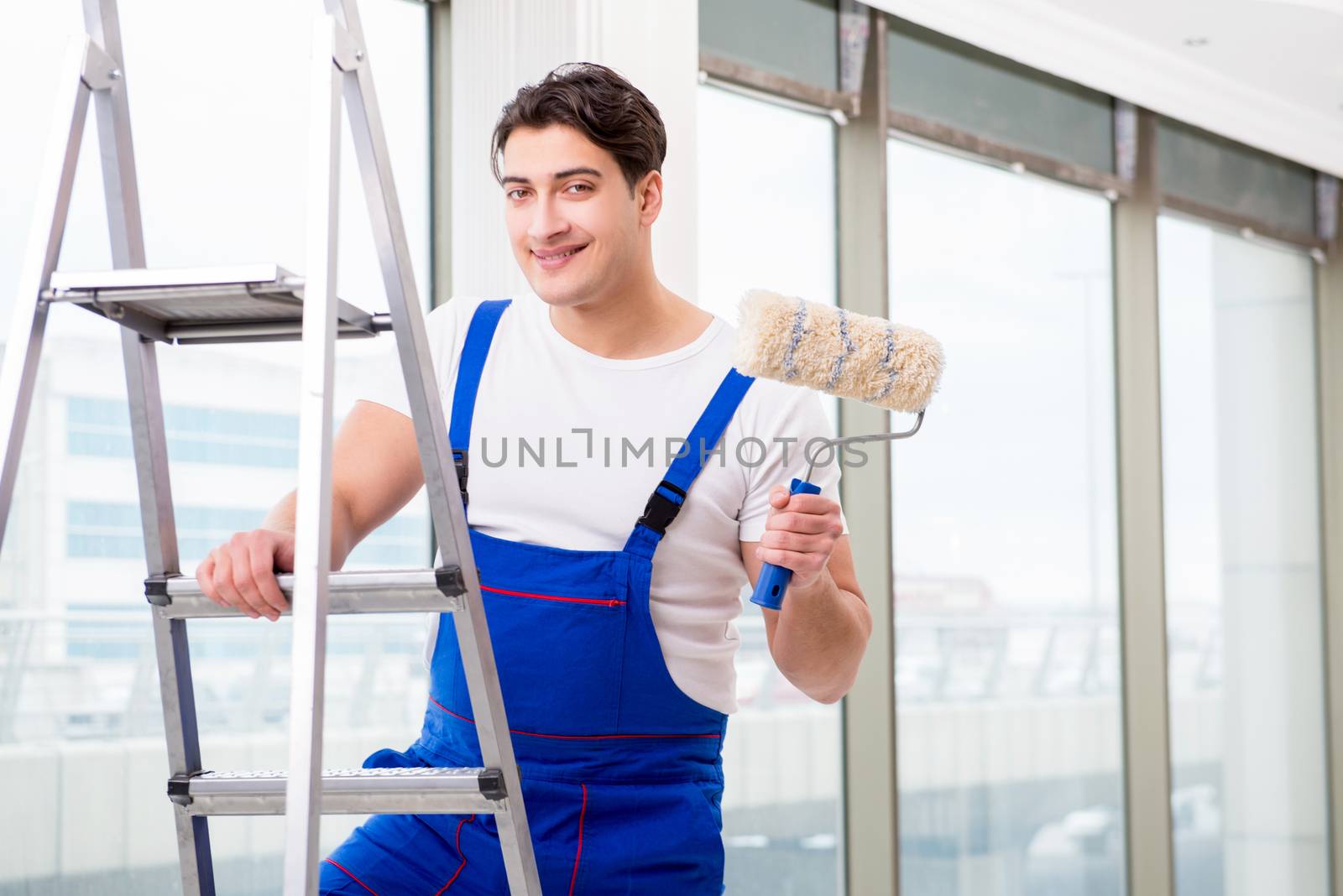 Painter repairman working at construction site