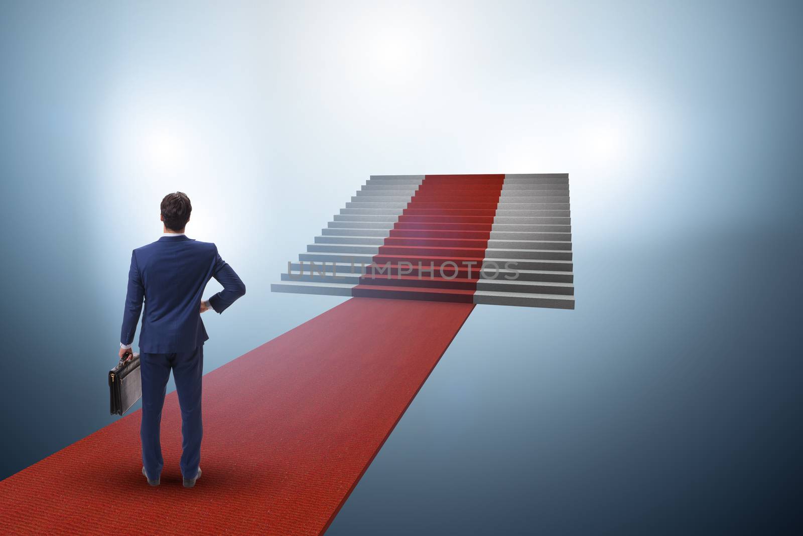 Young businessman climbing stairs and red carpet