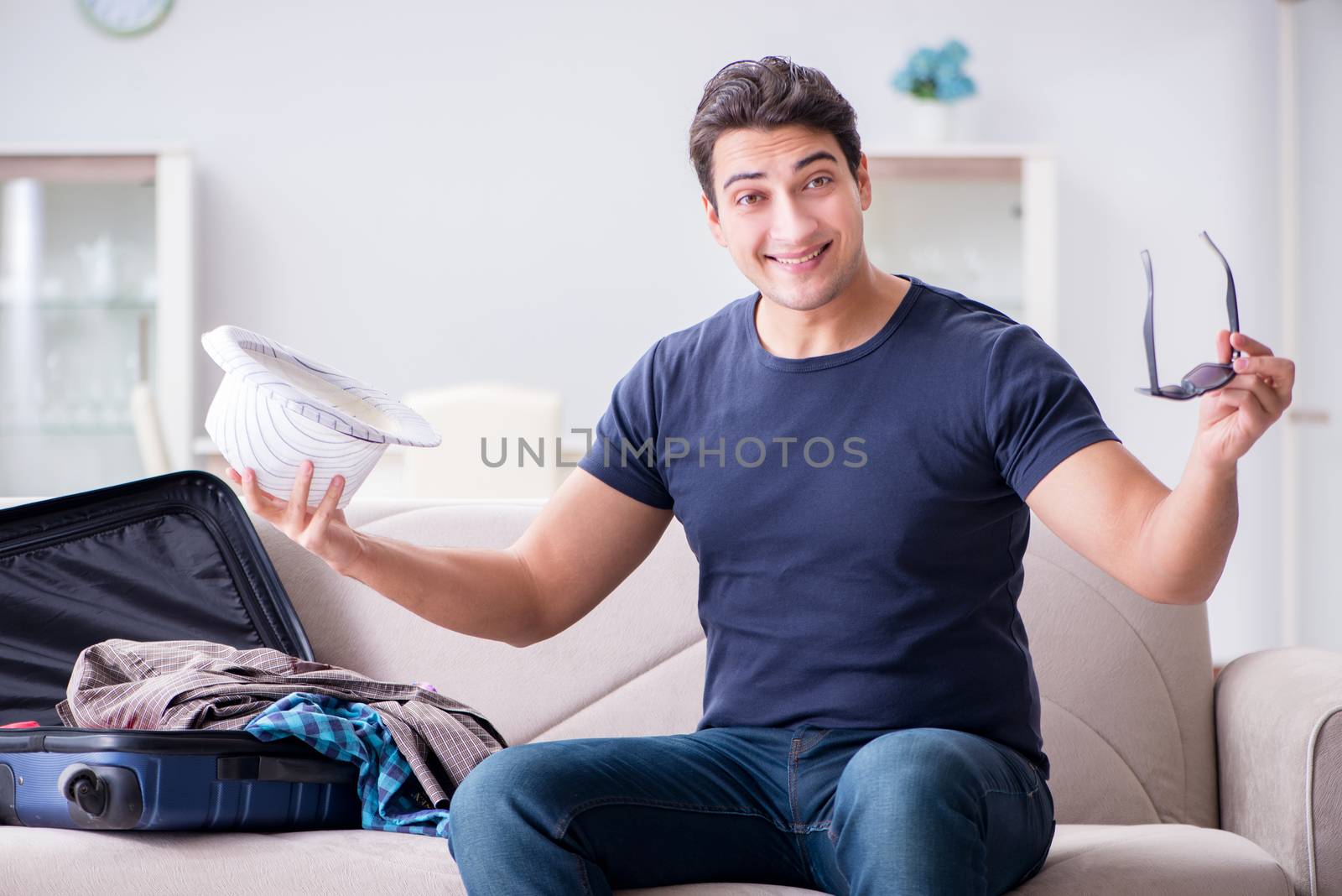 Man with hat preparing for summer vacation