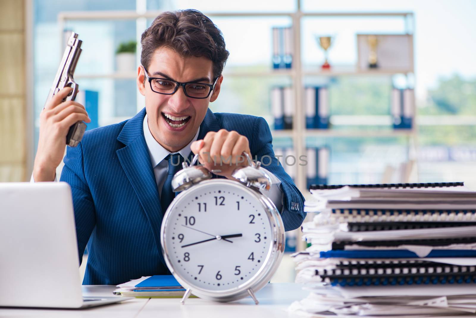 Stressed businessman thinking of suicide due to excessive workload