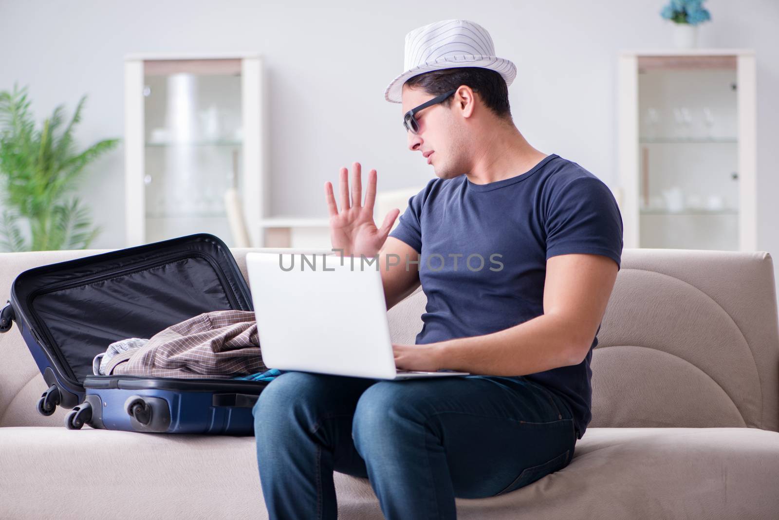 Man booking online his travel flight and hotel