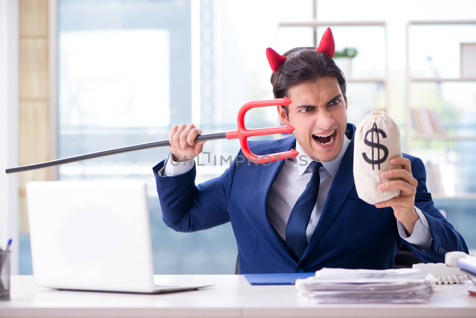 Devil angry businessman in the office