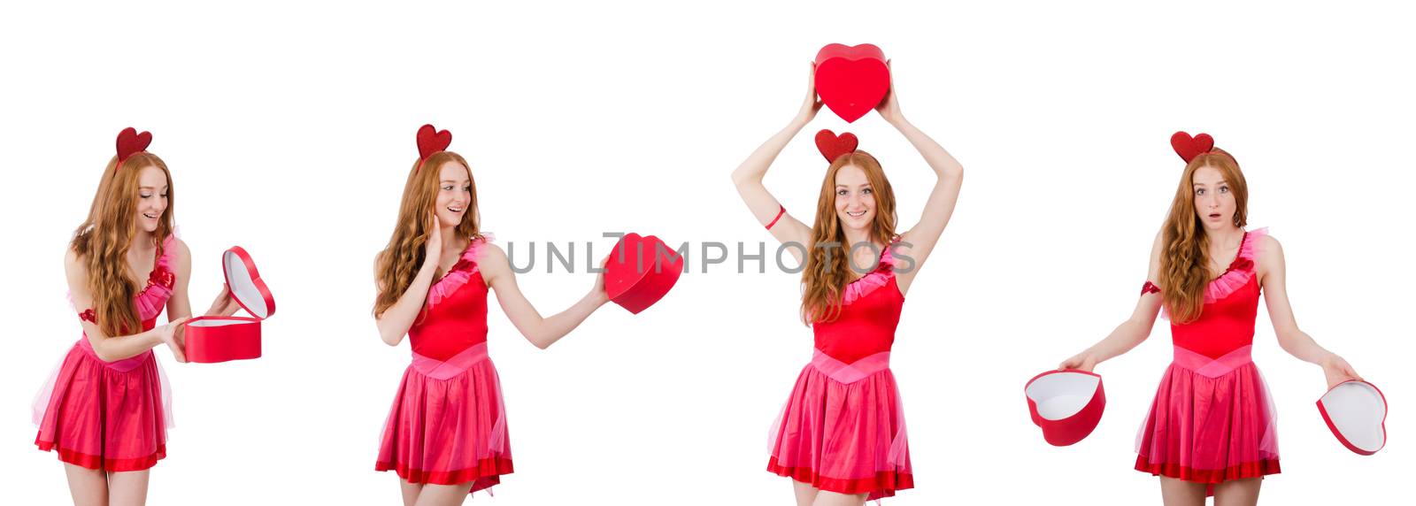 Pretty young model in mini pink dress holding gift box isolated on white