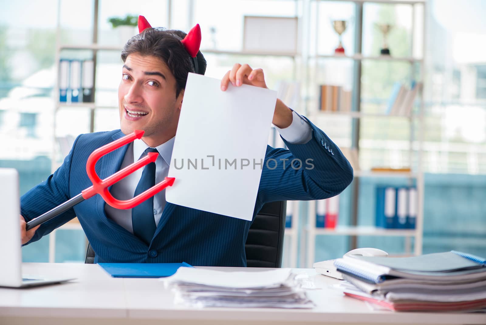 Devil angry businessman in the office