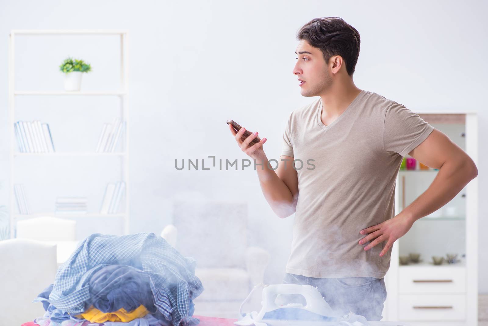 Inattentive husband burning clothing while ironing