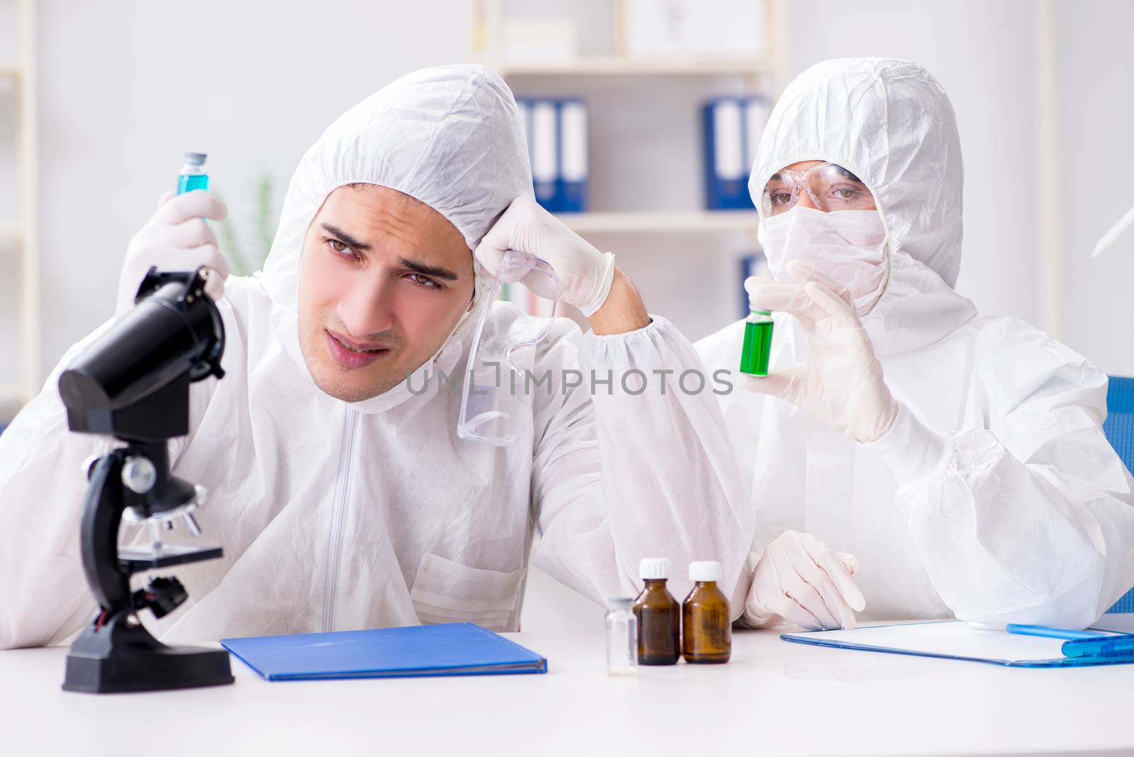 Two chemists working in the lab