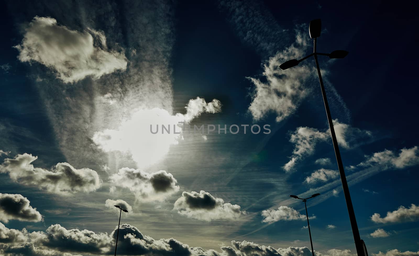 sky with clouds and lampposts