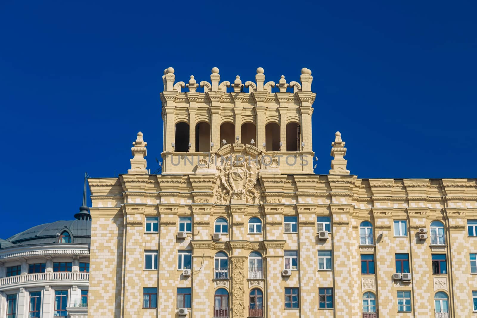 Facade of a building with stucco and columns in Moscow.