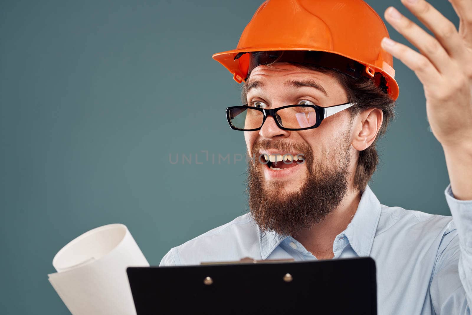 emotional worker in orange paint paperwork construction lifestyle fun. High quality photo