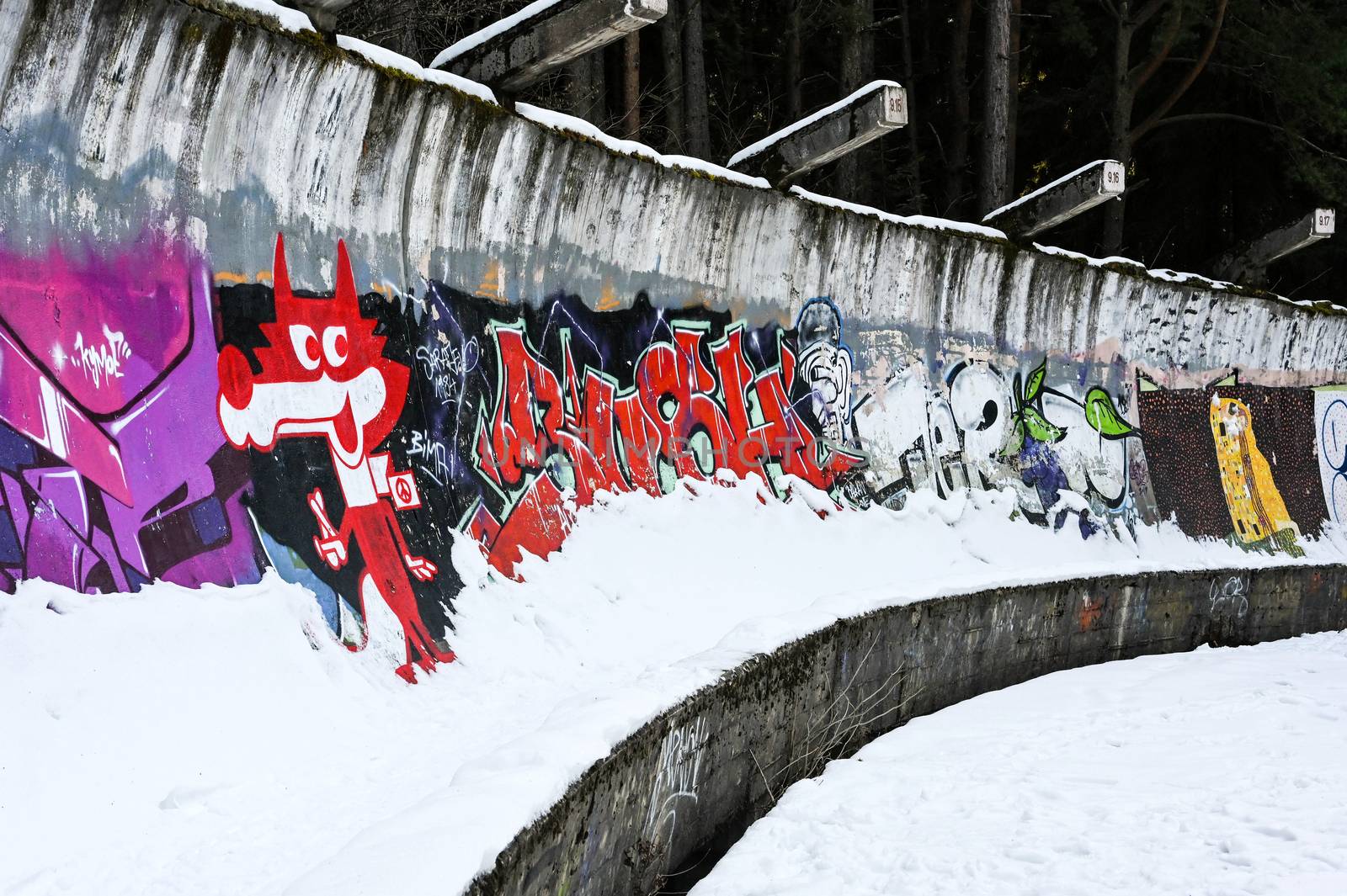 Abandoned bob trail on Trebevic Mountain near Sarajevo, decorated with graffiti
