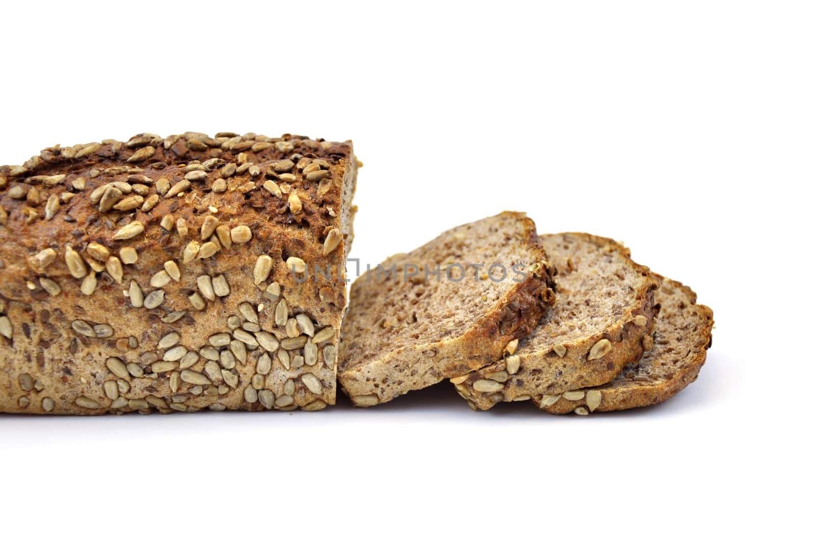 Whole wheat bread with seeds, isolated on white background and slices