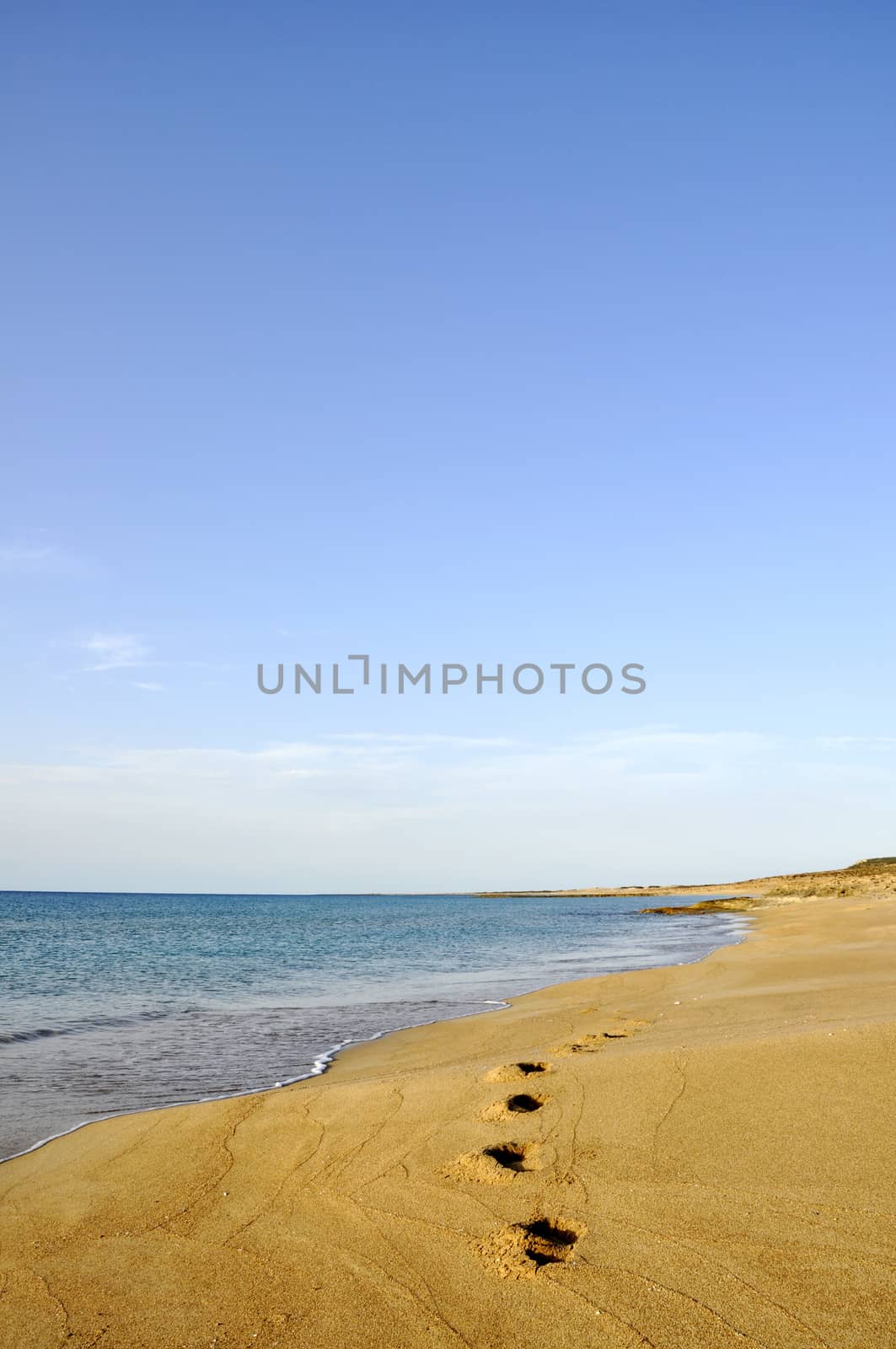 Footprints on sand beach in the morning during summer vacation in Cyprus by mixeey