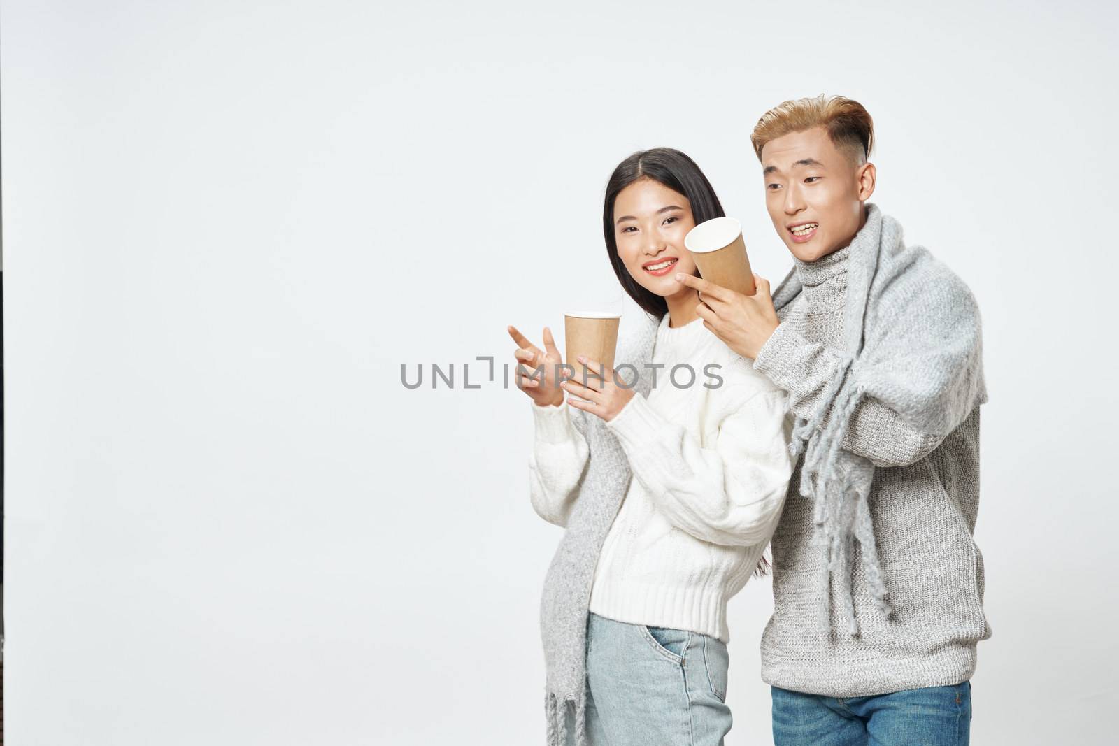 Man and woman warm drink sweaters coolness winter fashion