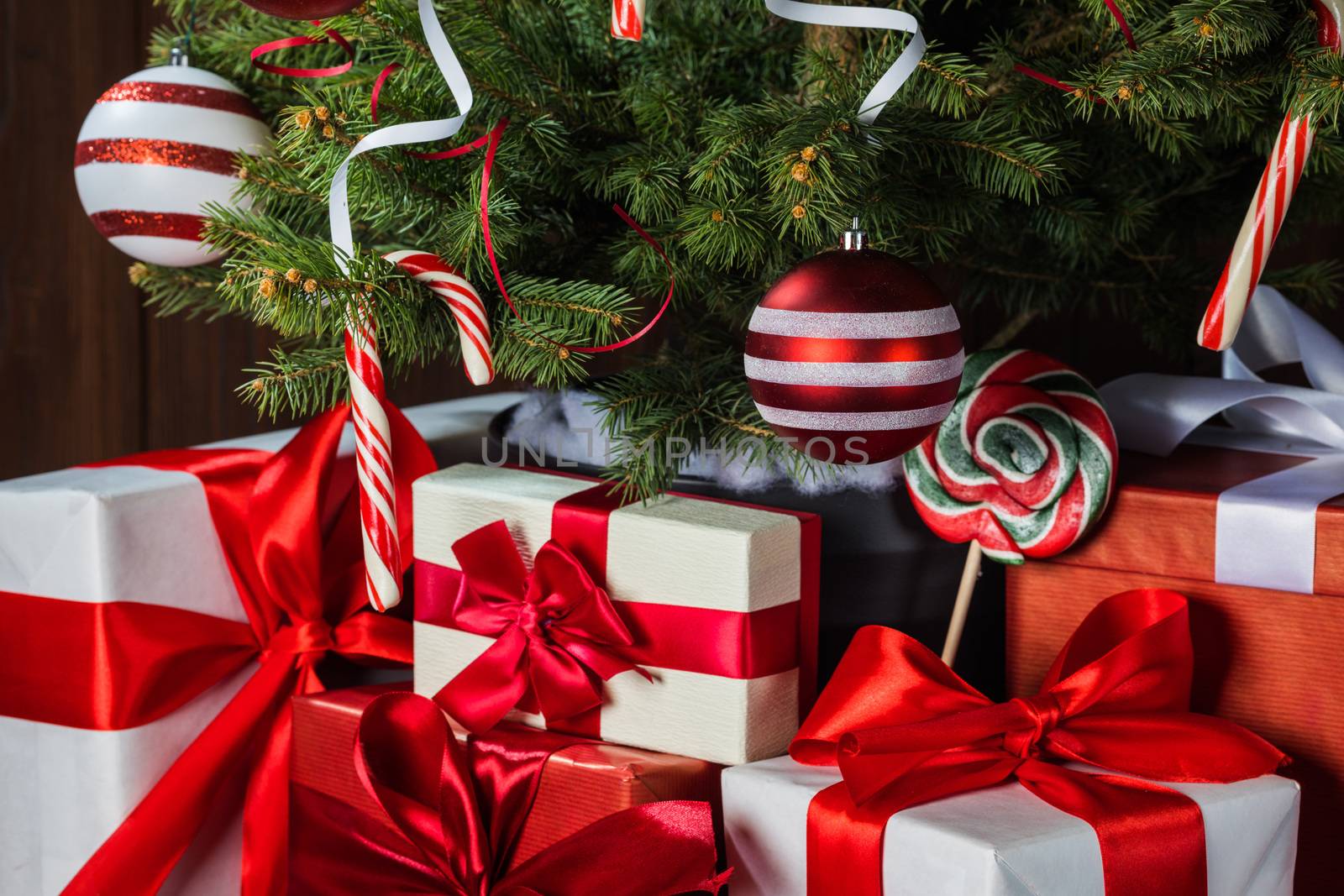 Decorated Christmas tree and gift boxes background