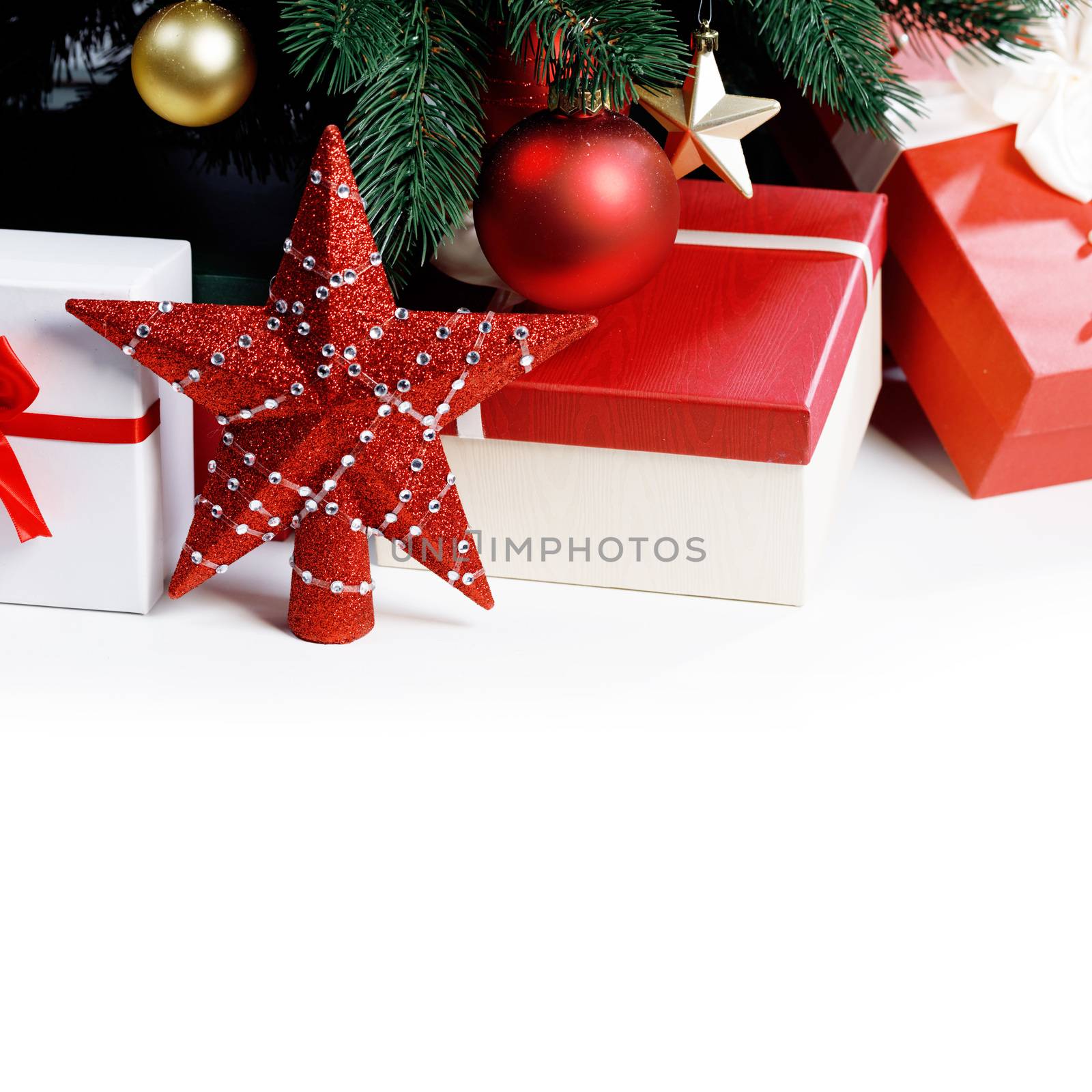 Decorated Christmas gifts and star isolated on white background