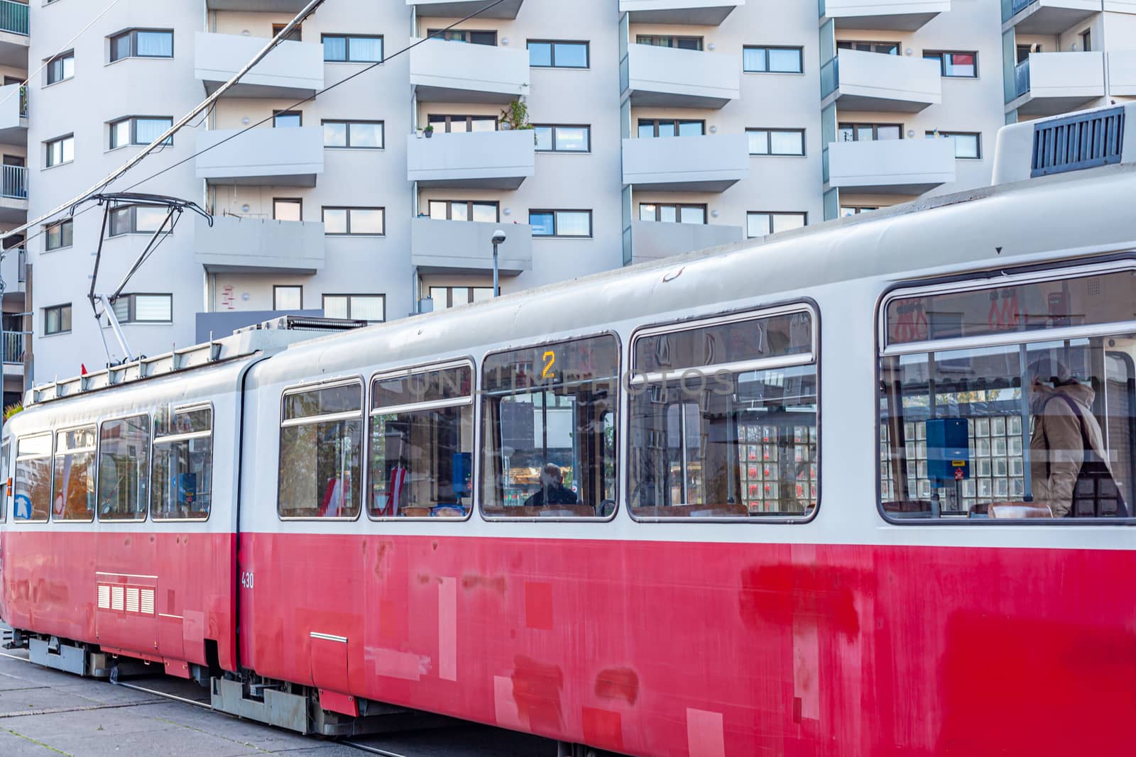 tram at the stop in the city center, public transport.