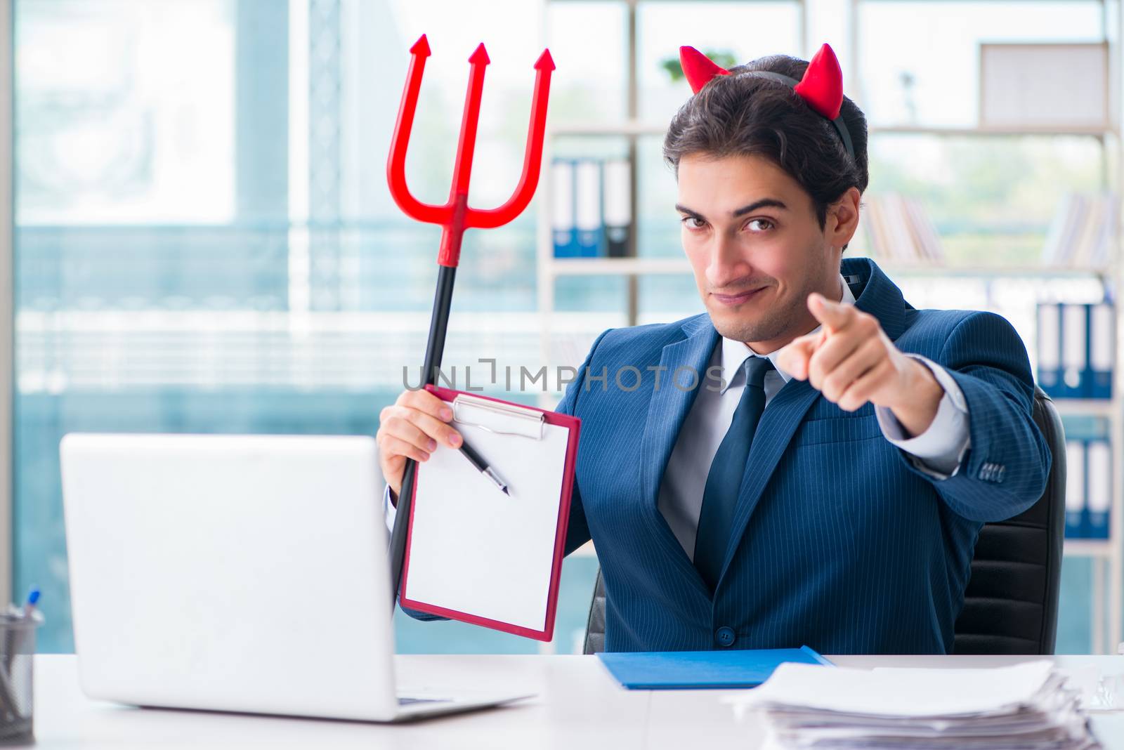 Devil angry businessman in the office