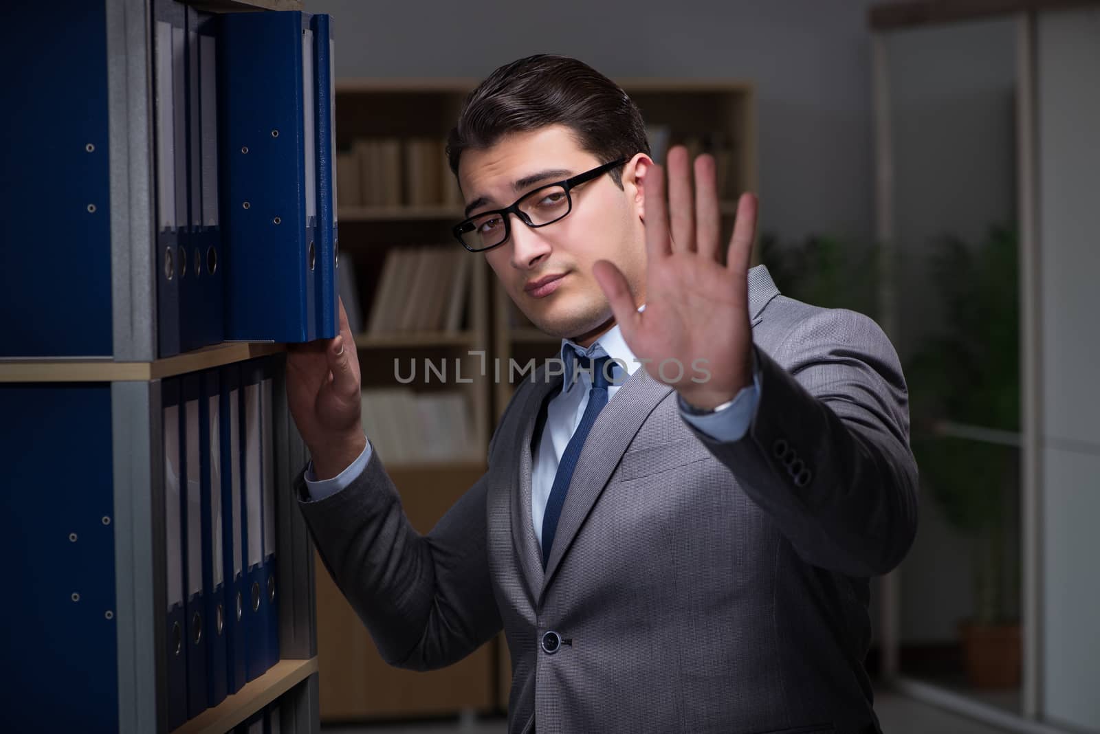 Businessman working late hours in the office