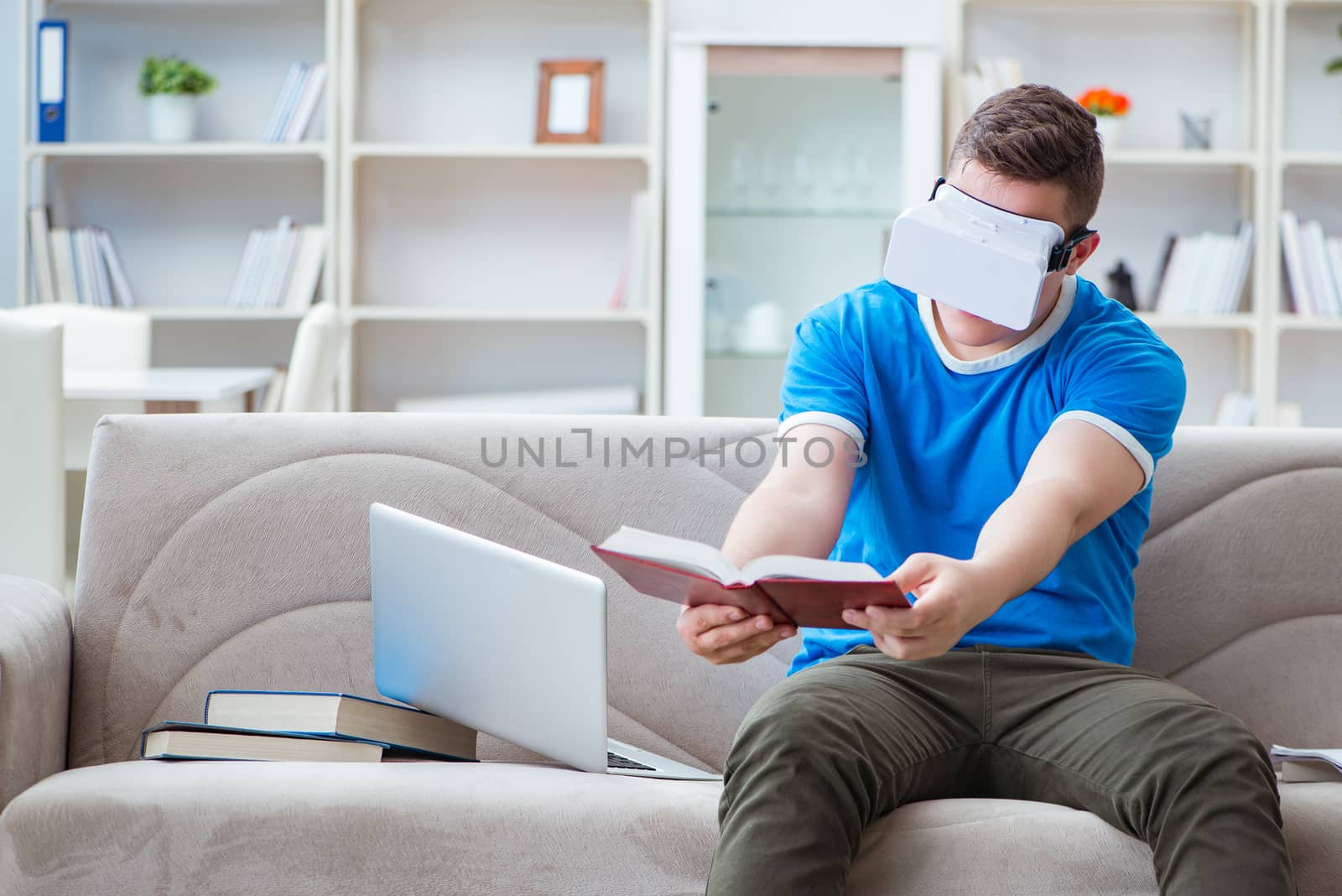 Young man student studying with virtual glasses