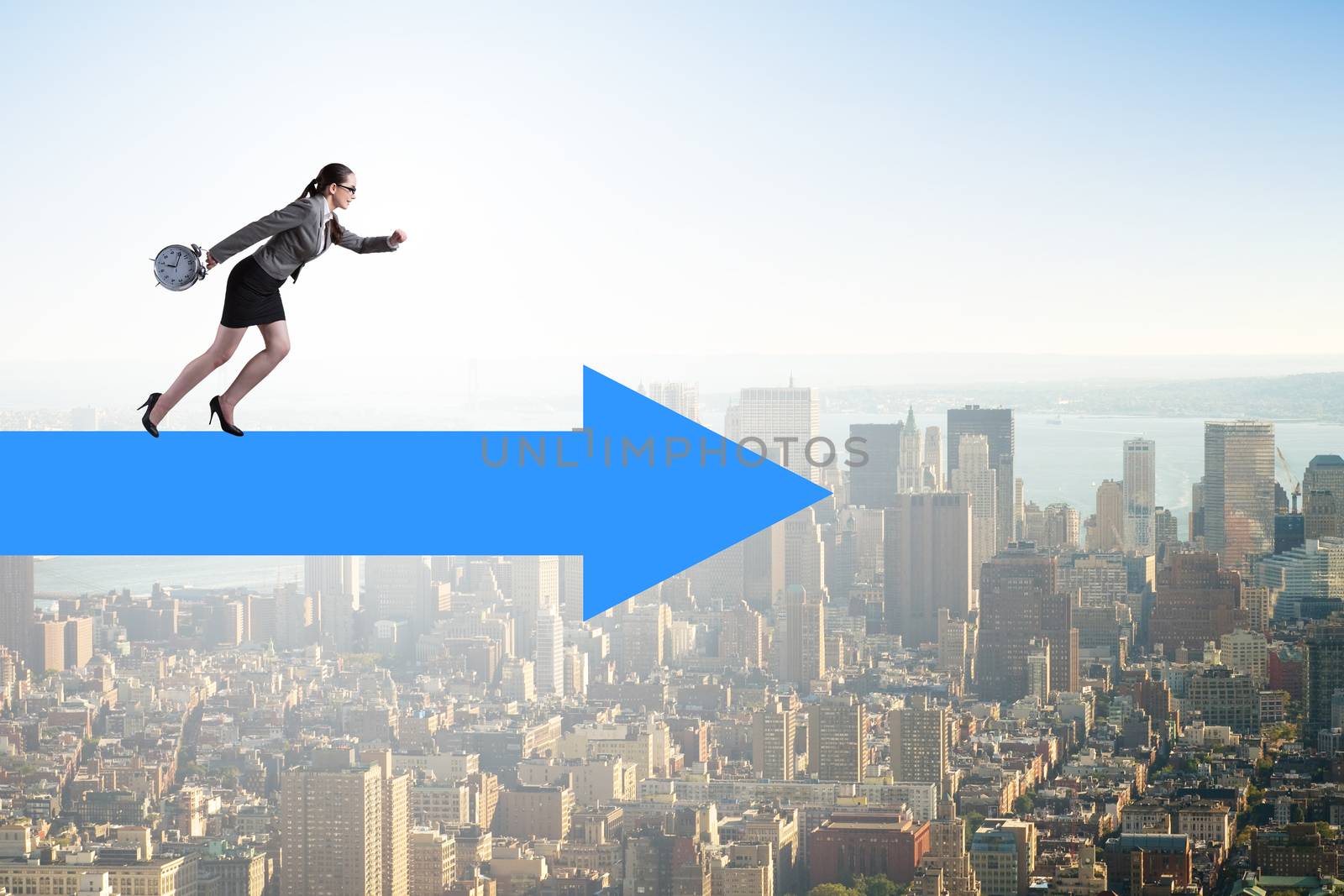 Businesswoman walking on arrow sign