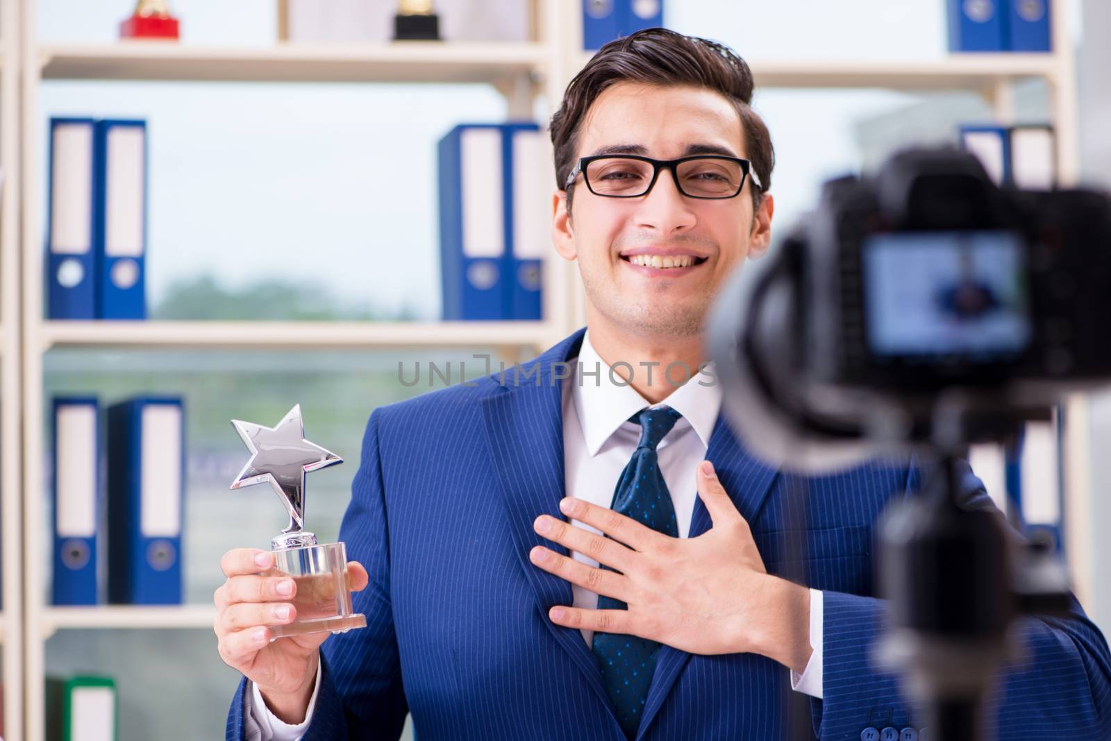 Businessman recording a video for vlog